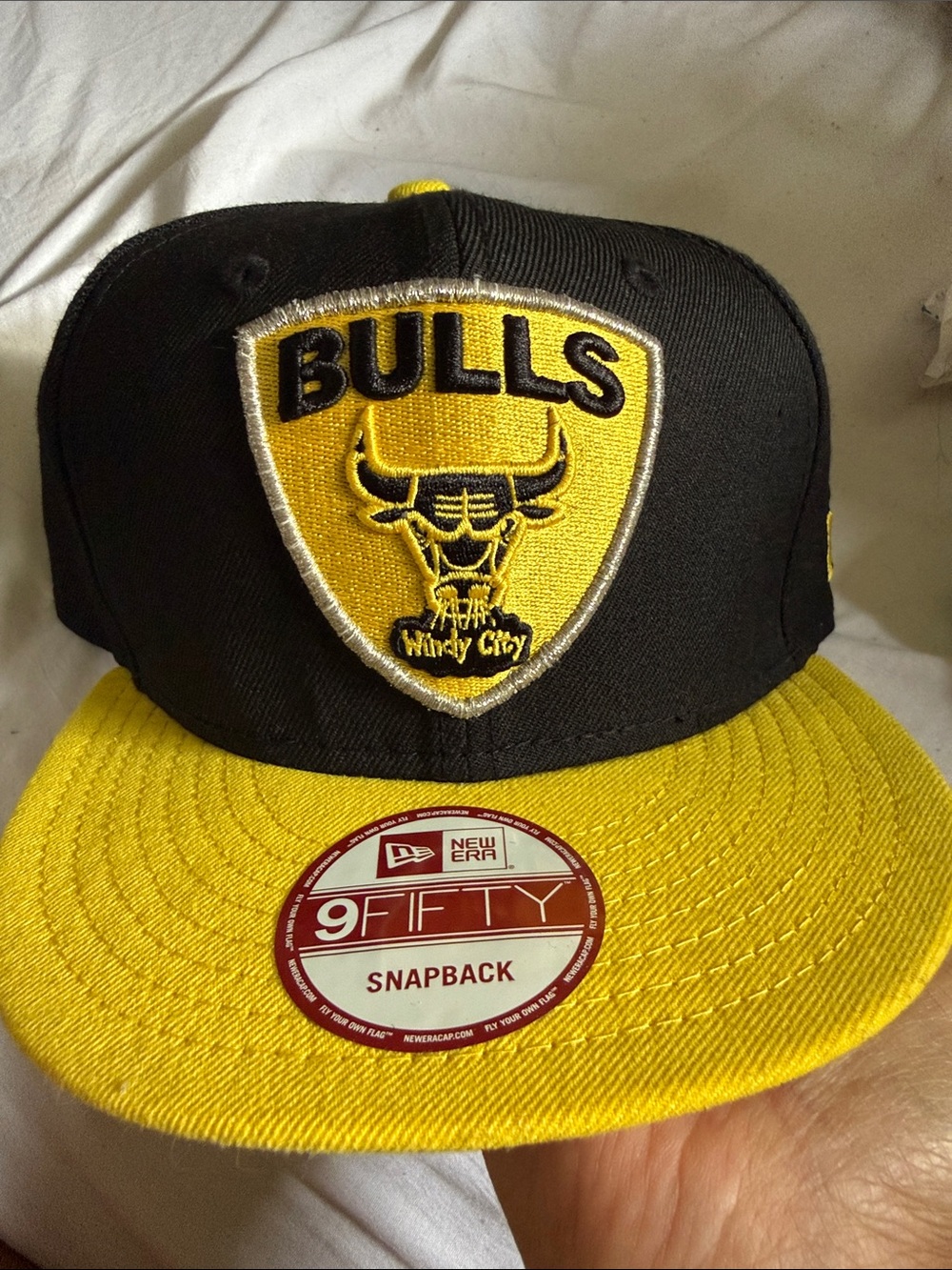 New Era Black and Yellow Bulls Shield Snapback